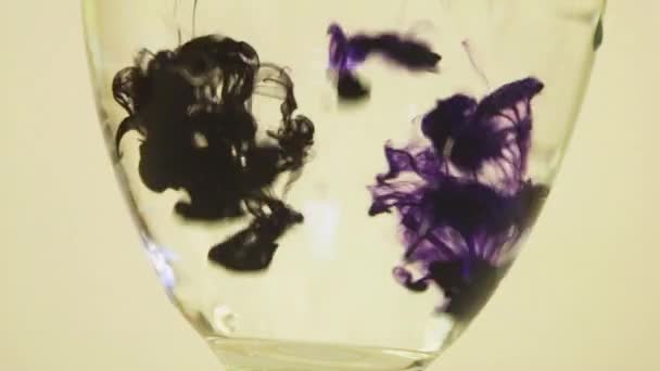 Color Dyes Being Added Wine Glass Purple Black — Vídeo de Stock