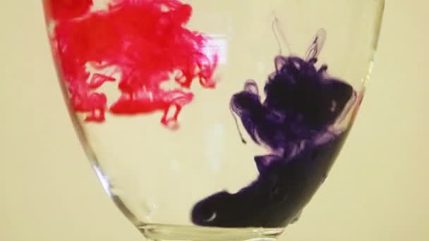 Color Dyes Being Added Wine Glass Purple Pink — Stockvideo