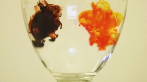Color Dyes Being Added Wine Glass Yellow Brown — ストック動画