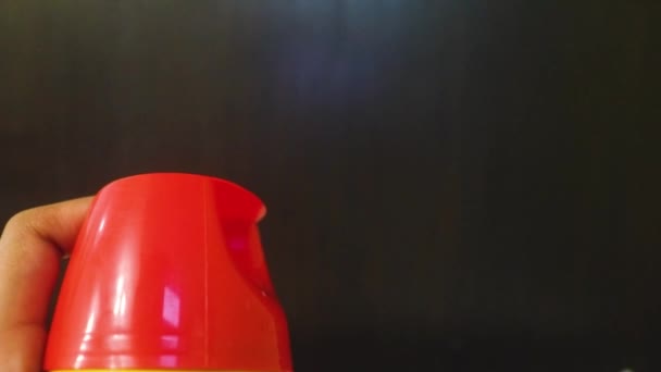 Ethnic Woman Spraying Solution Red Bottle — Stock Video