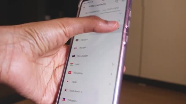 Female Hand Using Smartphone Connecting Different Vpn Locations — Stock Video