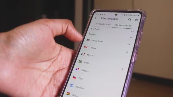 Female Hand Using Smartphone Connecting Different Vpn Locations — Stock Video