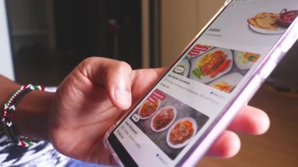 Using Food Delivery App Searching Indian Food — Vídeo de Stock