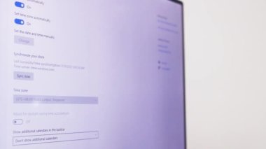 Checking Different Computer Settings On A Laptop - Time And Language