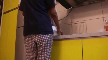 Ethnic Woman Plugging In A Blender