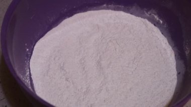 Pancake Mix Ingredients Being Added By Ethnic Woman