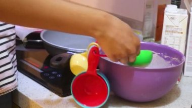 Pancake Mix Being Placed On A Frying Pan