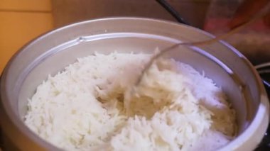 Rice Being Fluffed By Ethnic Woman