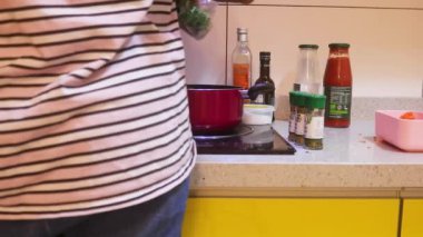 Vegetable Soup Ingredients Being Added Into Pot
