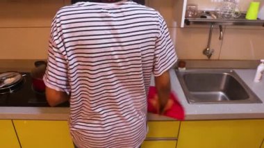 Wiping A Countertop With A Cloth And Gloves