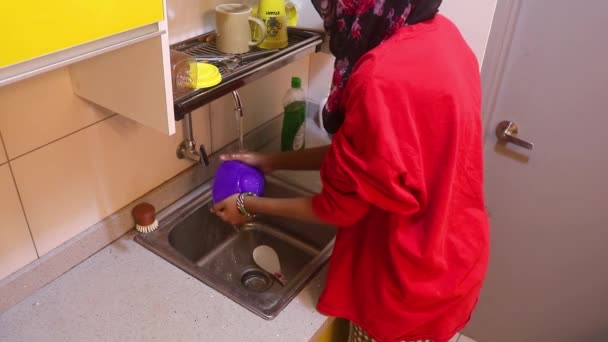 Muslim Lady Rinsing Dishes Placing Rack — Stok Video