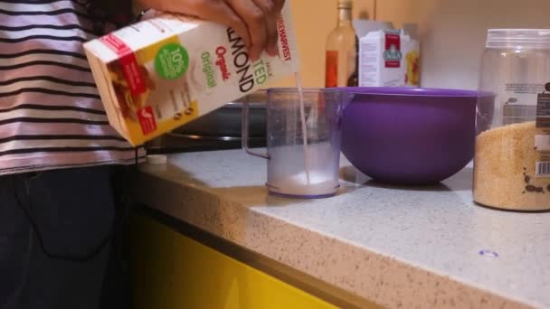 Pancake Mix Milk Being Measured Ethnic Woman — Stockvideo