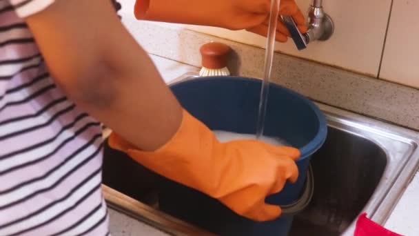 Young Woman Filling Bucket Soap Water — Stock video