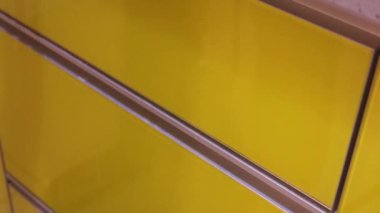 Ethnic Woman Arranging Cutlery Into A Drawer