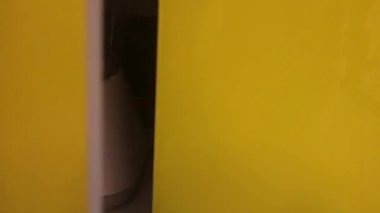 Ethnic Woman Getting Blender From A Cupboard 