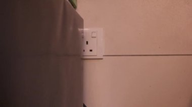 Ethnic Woman Plugging In A Blender 