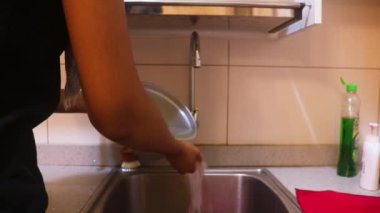 Rice In A Pot Getting Drained By Ethnic Woman.
