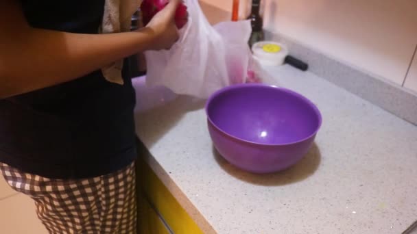 Ethnic Woman Removing Dragon Fruit Plastic Bag — Vídeo de stock