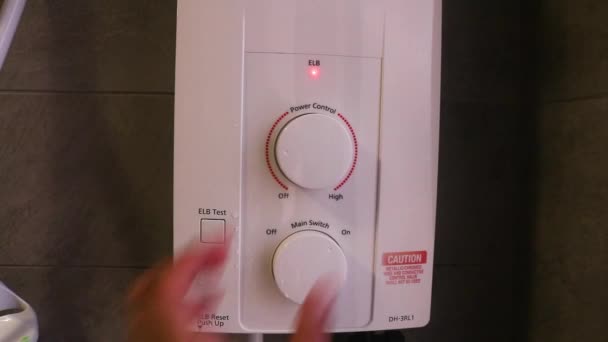 Shower Instant Heater Being Turned High Ethnic Hand — Stok Video
