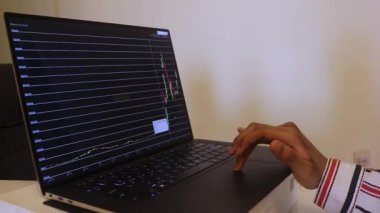 African Woman Looking At Binance Stock Chart Over The Years