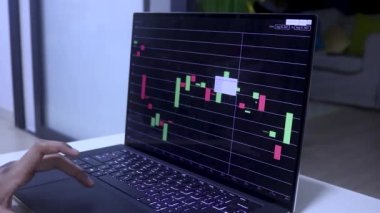 Side View Of Tanned Hands On Laptop Checking Chainlink's Stocks