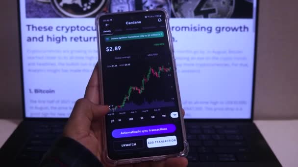 Woman Checking Cardano Monthly Stock Chart Mobile Phone — Vídeo de Stock