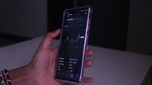 Woman Checking Litecoin Hourly Stock Chart Mobile Phone — стоковое видео