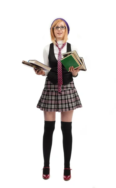 Menina com livros em pé sobre um fundo branco — Fotografia de Stock