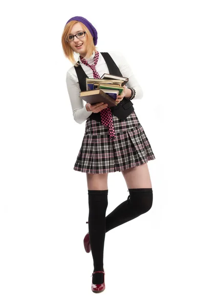 Girl with books standing on a white background — Stock Photo, Image