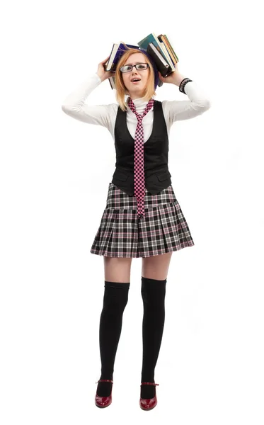 Girl with books standing on a white background — Stock Photo, Image