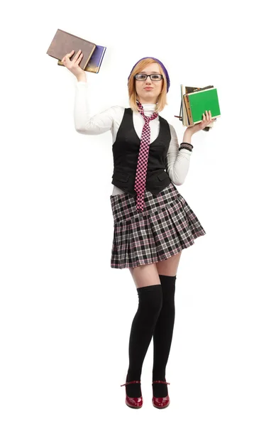 Girl with books standing on a white background — Stock Photo, Image