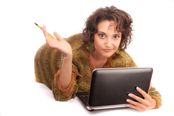 Thoughtful girl with a laptop on a white background — Stock Photo, Image