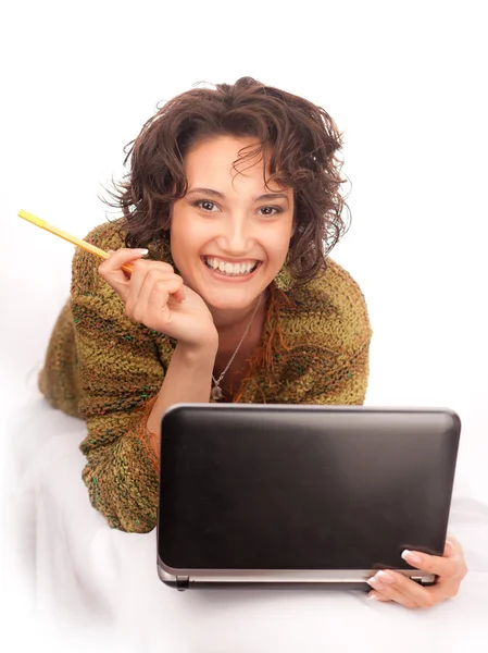 Laughing girl with laptop on a white background — Stock Photo, Image