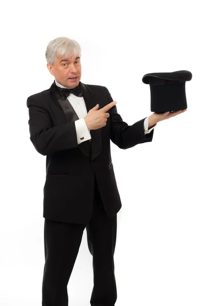 Elegant man in tuxedo and top hat a white background — Stock Photo, Image
