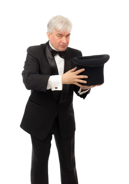 Elegant man in tuxedo and top hat a white background — Stock Photo, Image