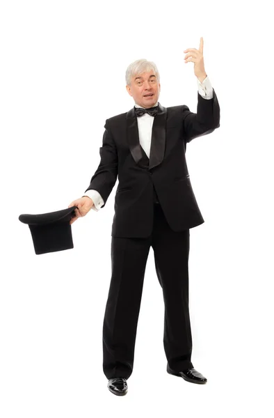 Elegant man in tuxedo and top hat a white background — Stock Photo, Image