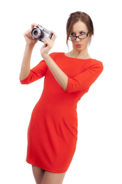 Girl in a red dress with shiny camera — Stock Photo, Image