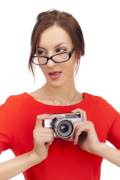 Meisje in een rode jurk met glanzend camera — Stockfoto