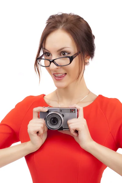 Meisje in een rode jurk met glanzend camera — Stockfoto