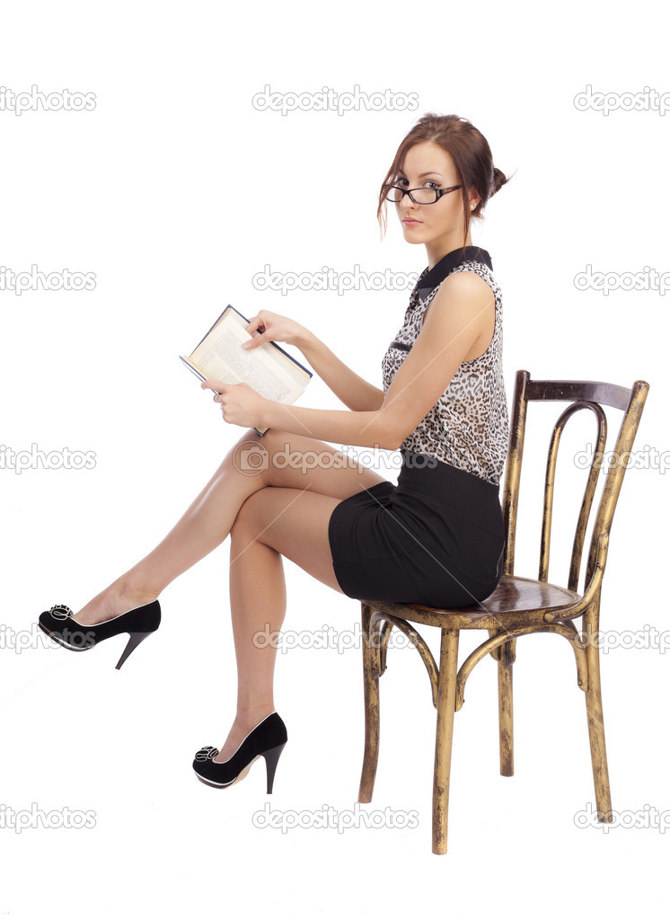 Girl sitting on a chair and reading a book Stock Photo by ©Oshepkov1962  38475523