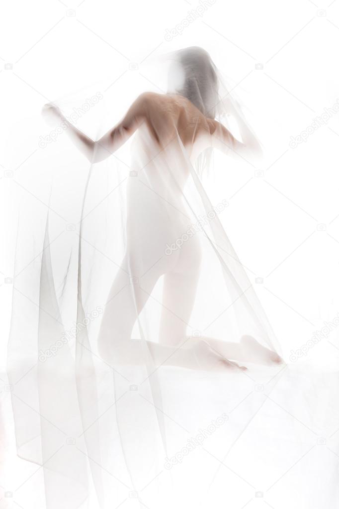 Naked girl covered with transparent cloth