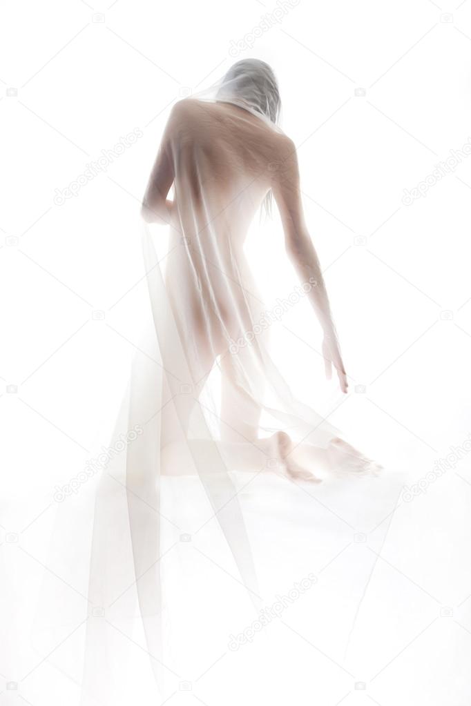 Naked girl covered with transparent cloth