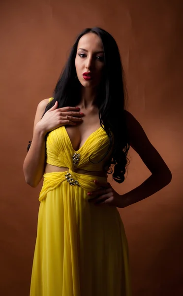 Girl in a yellow dress — Stock Photo, Image