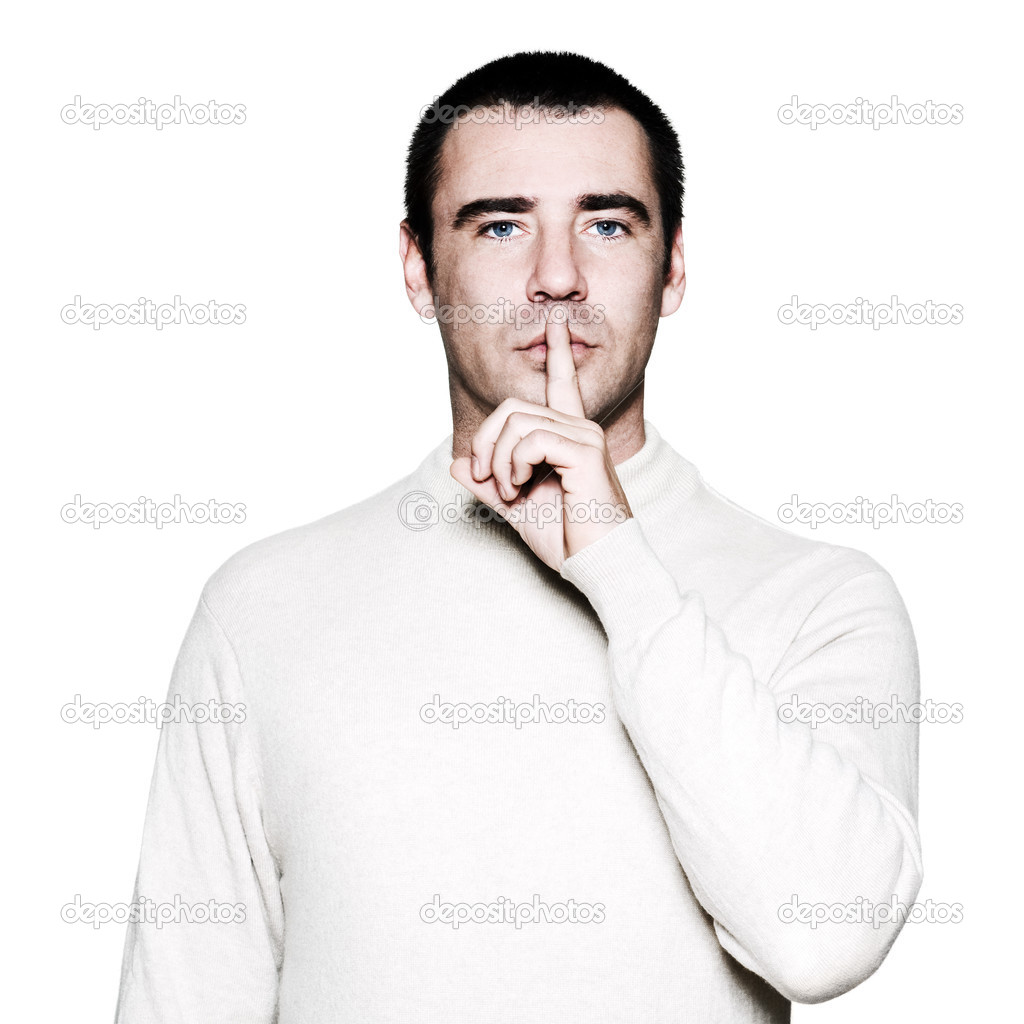 Man with finger on his lips
