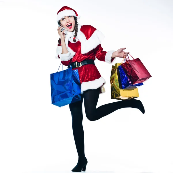 Nő Mikulás karácsonyi bevásárlás, a telefon — Stock Fotó