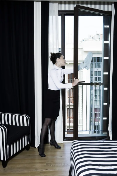 Woman maid in a hotel bedroom — Stock Photo, Image