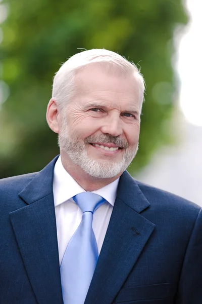 Senior businessman portrait toothy smiling — Stock Photo, Image