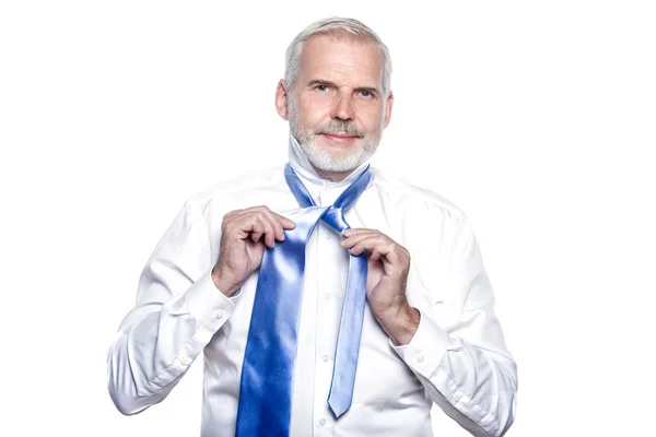 Man senior getting dressed tying windsor necktie — Stock Photo, Image