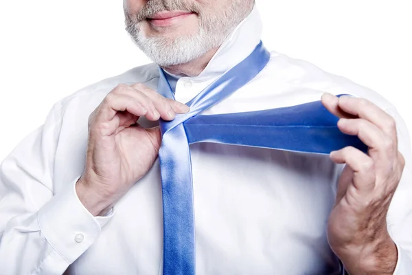 Man senior getting dressed tying windsor necktie — Stock Photo, Image