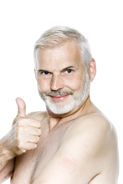 Senior man portrait thumb up nicotine patch — Stock Photo, Image